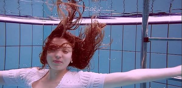  Redhead Marketa in a white dress in the pool